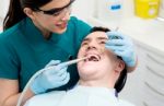 Male Getting His Teeth Examined Stock Photo