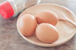 Fresh Eggs On Wooden Plate Stock Photo