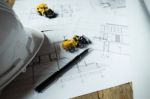 Blueprints, Hardhat Or Safty Helmet, Pen In Architecture Office Stock Photo