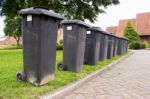 Grey Garbage Containers In A Row Stock Photo