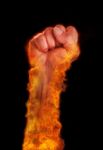 Hand With Fire Burning On Black Background Stock Photo