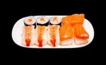 Sushi In White Plate On Black Background Stock Photo
