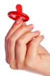 Hand Holding A Condom Stock Photo