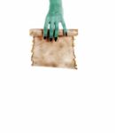Monster Hand Holding A Folded Roll Of Old Paper (letter Or Invit Stock Photo