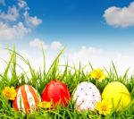 Easter Eggs On Green Grass Stock Photo
