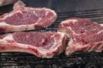 Grilling Steak On The Barbecue Stock Photo