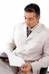 Businessman reading file Stock Photo