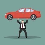 Businessman Carry A Heavy Car Stock Photo