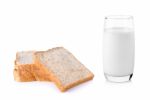 Fresh Milk In The Glass Wiht Whole Wheat Breadon White Backgroun Stock Photo
