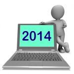 Two Thousand And Fourteen Character And Laptop Shows Year 2014 Stock Photo