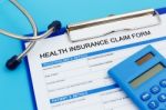 Health Insurance Claim Form With Calculator Stock Photo