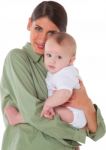Loving Young Mother Carrying Baby Boy Stock Photo