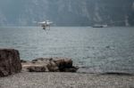 Drone Hovering On The Shoreline At Riva Del Garda Stock Photo