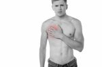 Young Man Having Chest Pain Stock Photo