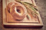Bagels On Bread Board Stock Photo