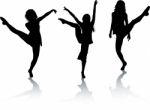 Silhouettes Of Dancing Women Stock Photo
