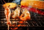 Prawn ,shrimp Grilled On Barbe-que Fire Stove With Pineapple ,red Chilly And Corn Stock Photo