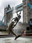 David Wayne Sculpture Girl With The Dolphin Next To Tower Bridge Stock Photo