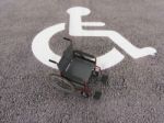 Wheelchair In Disabled Space Stock Photo
