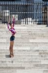 Ballerina Posing On The Steps Of The Hungarian Parlaiament Build Stock Photo