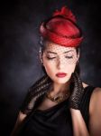 Woman With Red Hat And Black Gloves Stock Photo