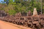 Statues Of Ancient Khmer Warrior Heads Carry Giant Snake Decorat Stock Photo