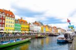 Nyhavn, 17th Century Waterfront, Canal And Entertainment District And The Popular Tourist Destination In Copenhagen, Denmark Stock Photo