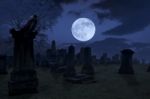Spooky Night At Cemetery With Old Gravestones, Full Moon And Bla Stock Photo