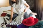 Woman Hand Packing A Luggage For A New Journey And Travel For A Stock Photo