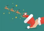 Santa Claus With Reindeer Sleigh Flying Out Of The Santa Hat Stock Photo
