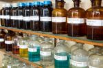 Rows Of Liquid Chemicals In Bottles At Chemistry Stock Photo