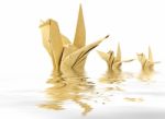 Origami crane floating in water Stock Photo