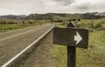 Blank Sign With Arrow Head Along The Country Road Stock Photo