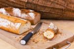 Rye And Wheat Bread Loafs And A Knife On Wooden Cutting Board Stock Photo