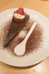 Mr.santa On Dark Chocolate Tart For  Christmas Stock Photo
