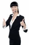 Gorgeous Telecaller Showing Double Thumbs Up Stock Photo