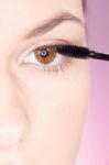 Woman Applying Mascara Stock Photo