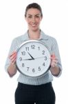 Business Woman Holding Wall Clock Stock Photo