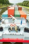 Ship Carrying Containers On Canal Stock Photo
