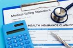 Health Insurance With Calculator Stock Photo