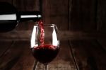 Red Wine Pour From Bottle Stock Photo