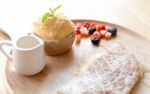 Fresh Dessert Soft Vanila Roti With Ice Cream ,syrup ,strawberry Stock Photo