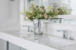 Modern Wash Basin With  Counter And Vase Of Flower Stock Photo