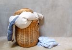 Clothes In Wicker Basket Stock Photo