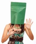 Girl With Bag On Head Hiding Stock Photo
