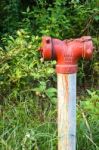 Old Red Fire Hydrant In Rural Of Thailand Stock Photo