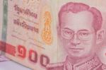 Close Up Of Thailand Currency, Thai Baht With The Images Of Thailand King. Denomination Of 100 Bahts Stock Photo