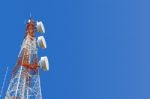 Telecommunication Tower On Blue Sky Background Stock Photo