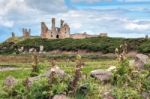 View Of Dunstanburgh Castle At Craster Northumberland Stock Photo