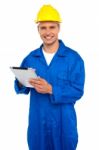 Young Builder Holding Tablet Pc Stock Photo